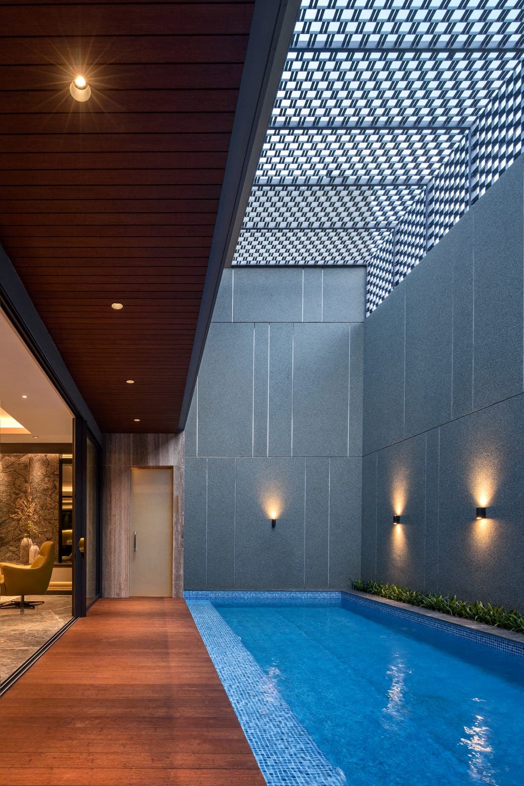 The lap pool, held behind a perforated screen.