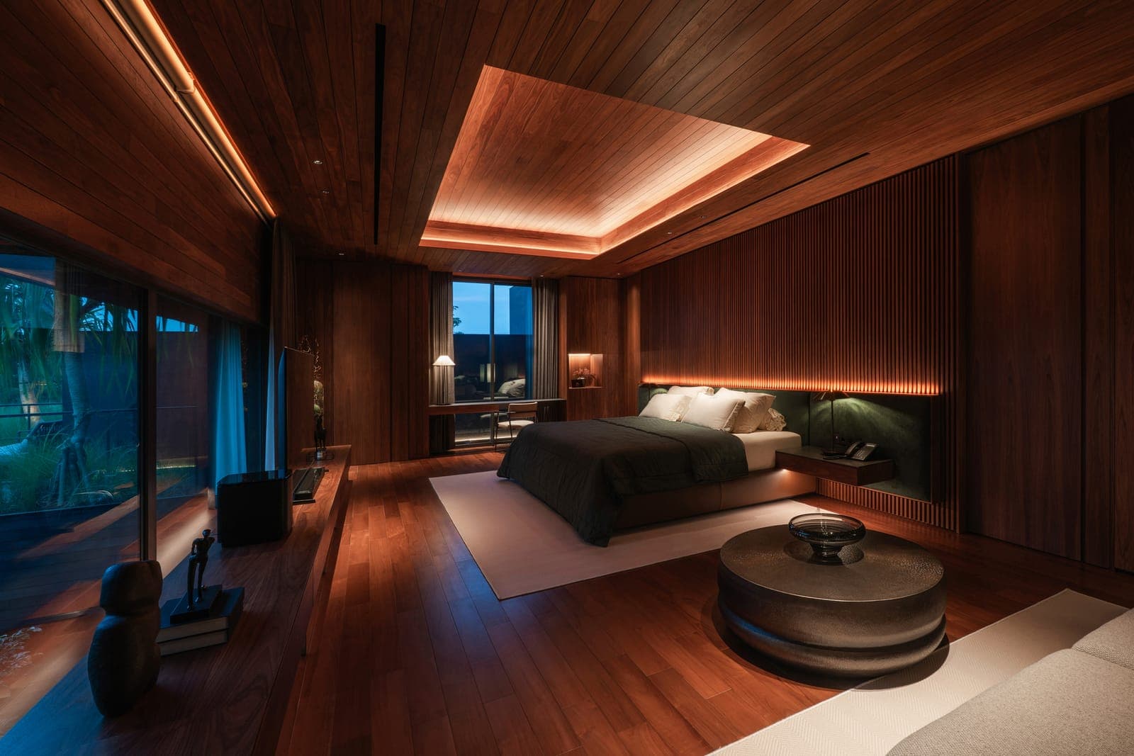 Dark timber and cove light in the bedroom.