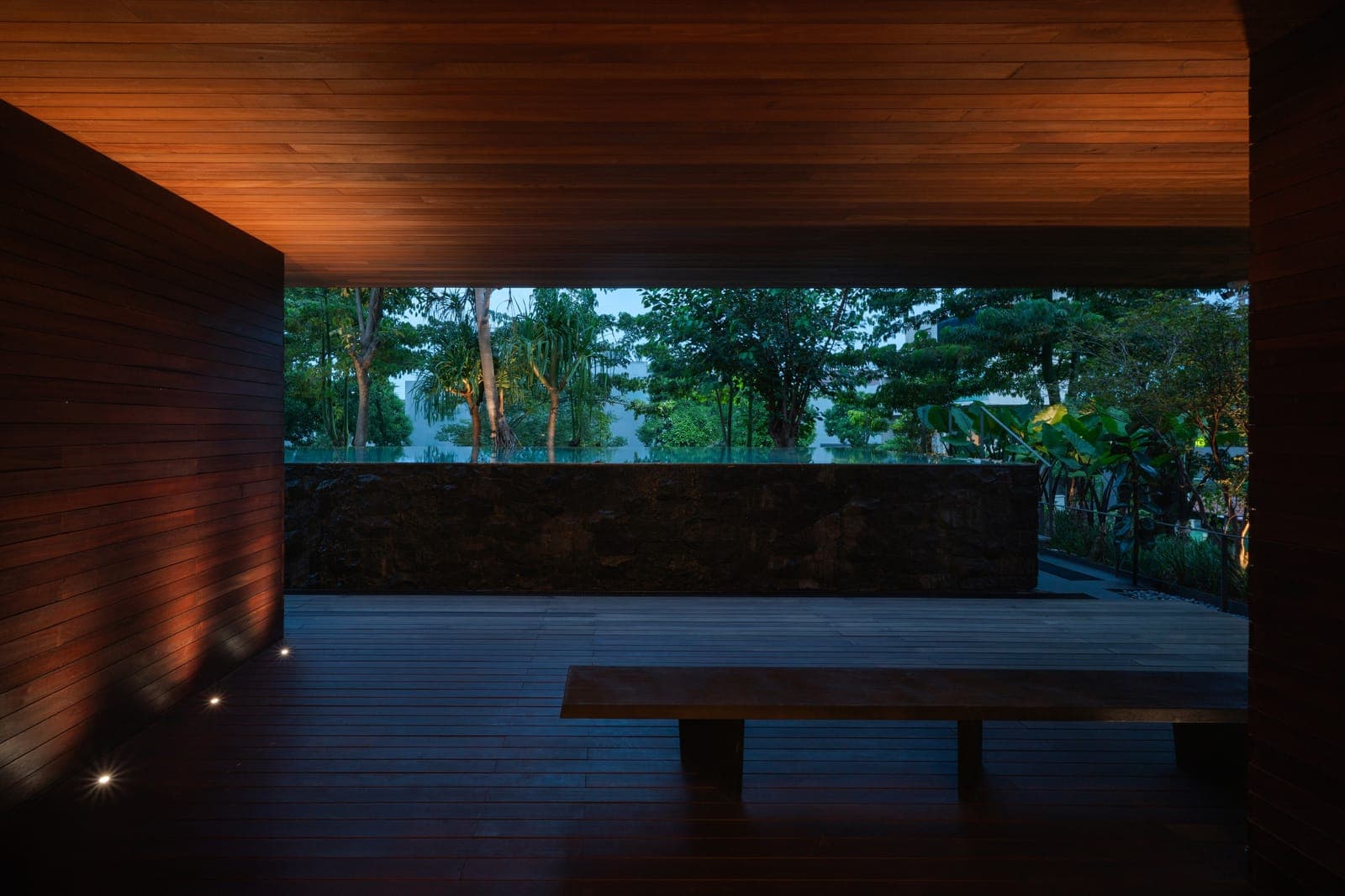 A bench under the soffit, looking out.