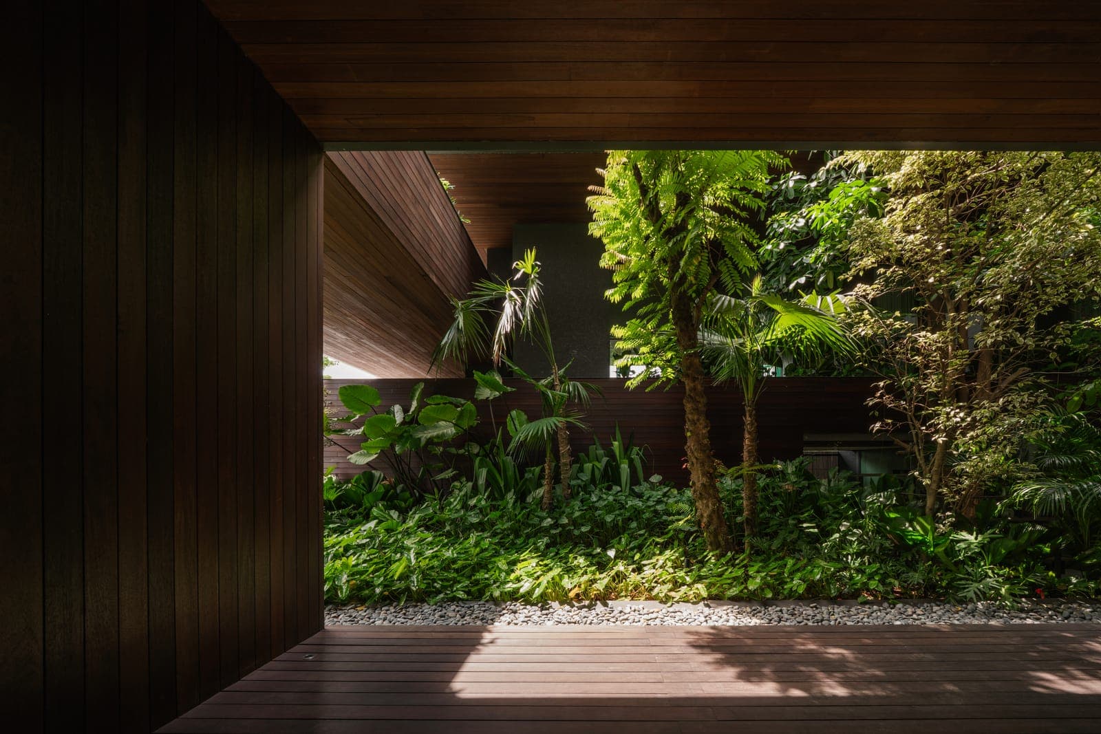 A room open on both sides to a planted court.