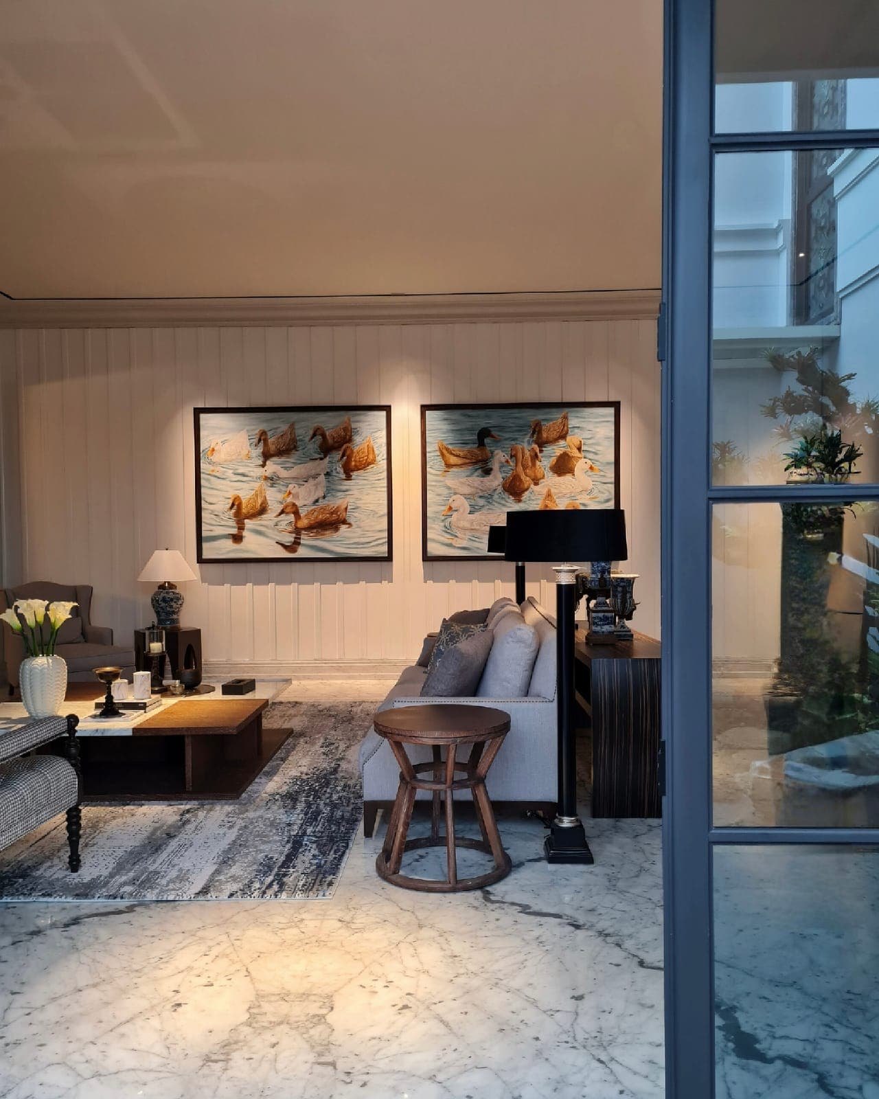 The sitting room, past the glazed screen.