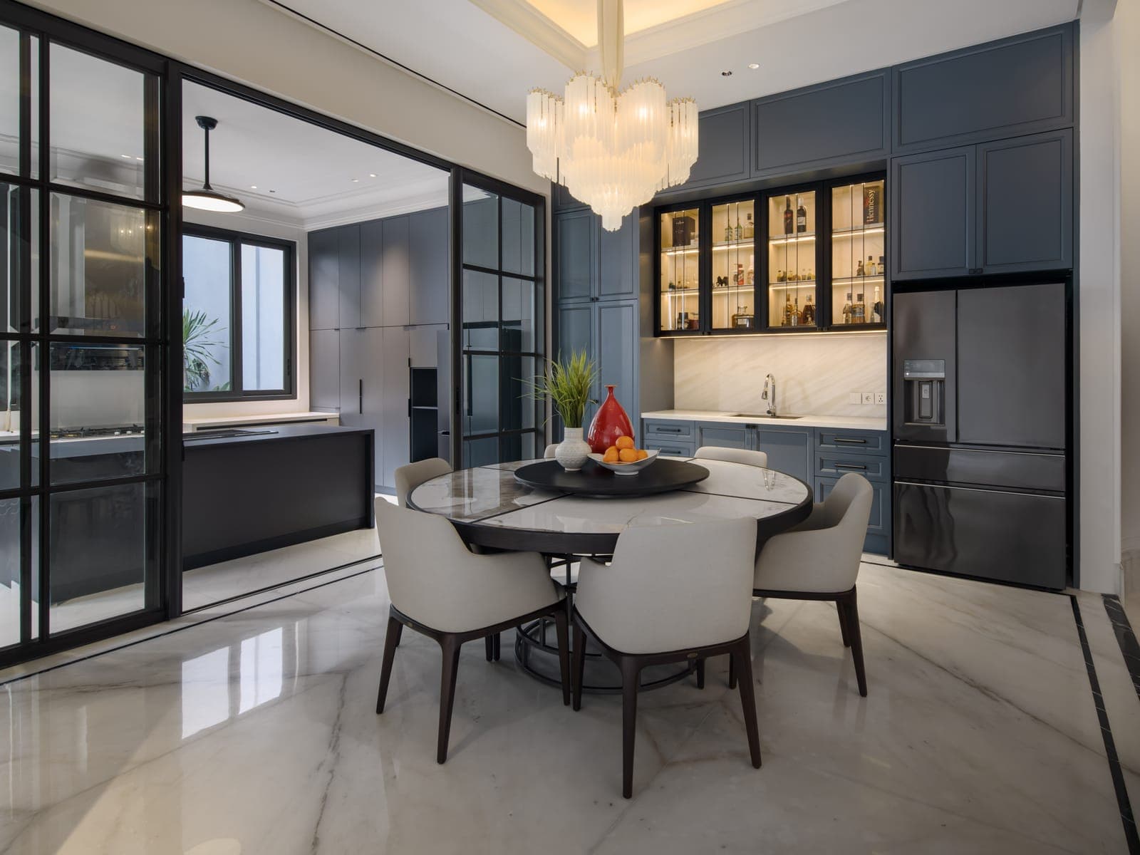 Black gridded glazing between kitchen and dining room.