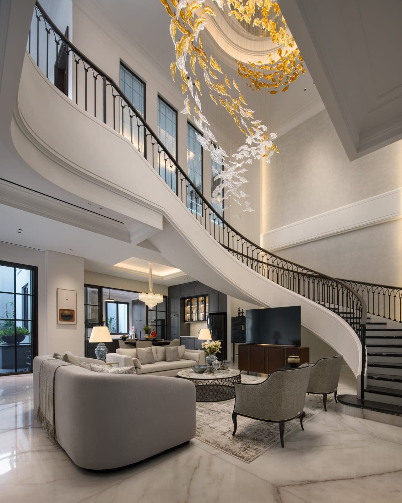 The stair, curving through two storeys.