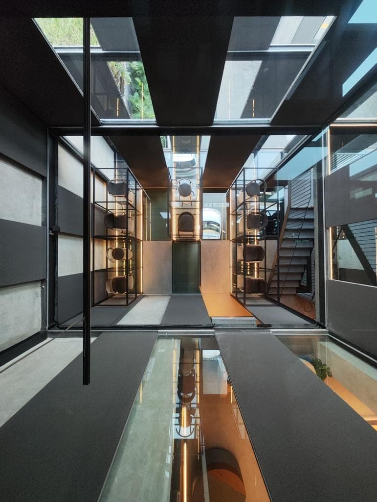 The long axis, over floors that are themselves glazed.