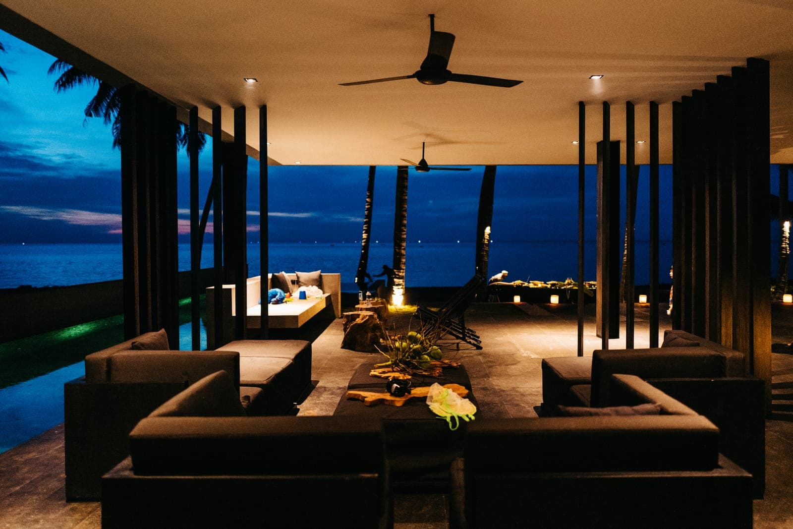 The lounge, lit and open on two sides to the sea.