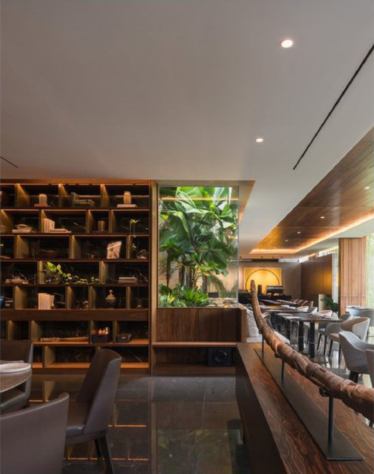 The main hall — shelving, greenery and a long communal counter.