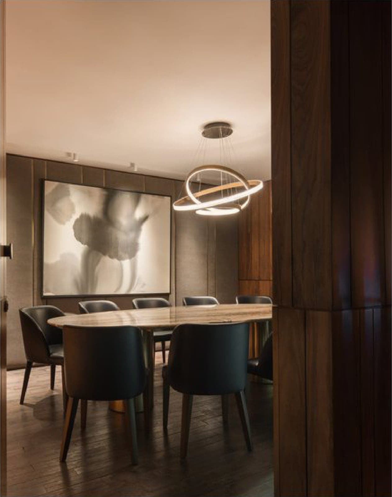 A soundproofed private room, set around a marble table.