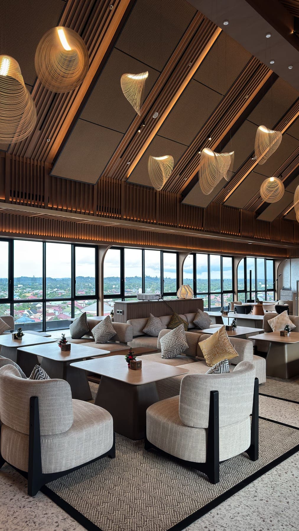 The pitched batten ceiling, and the glazed elevation that runs the length of the lounge.