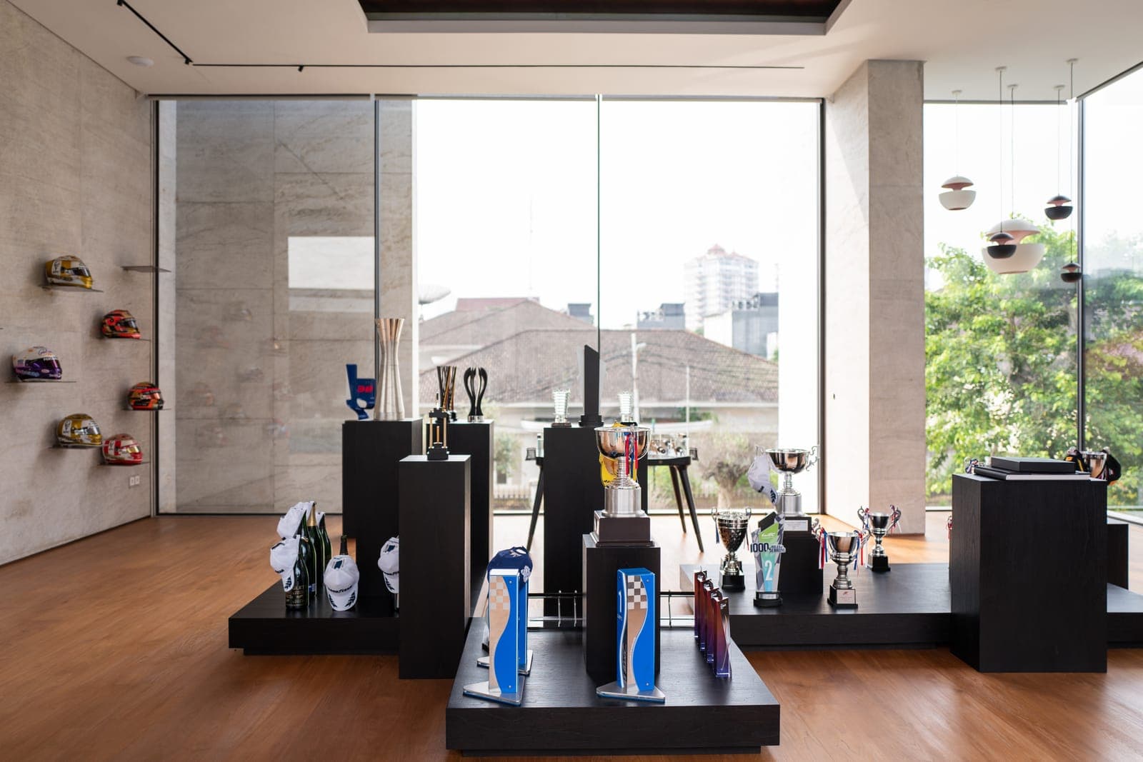 The collection room, lit from a wall of frameless glass.
