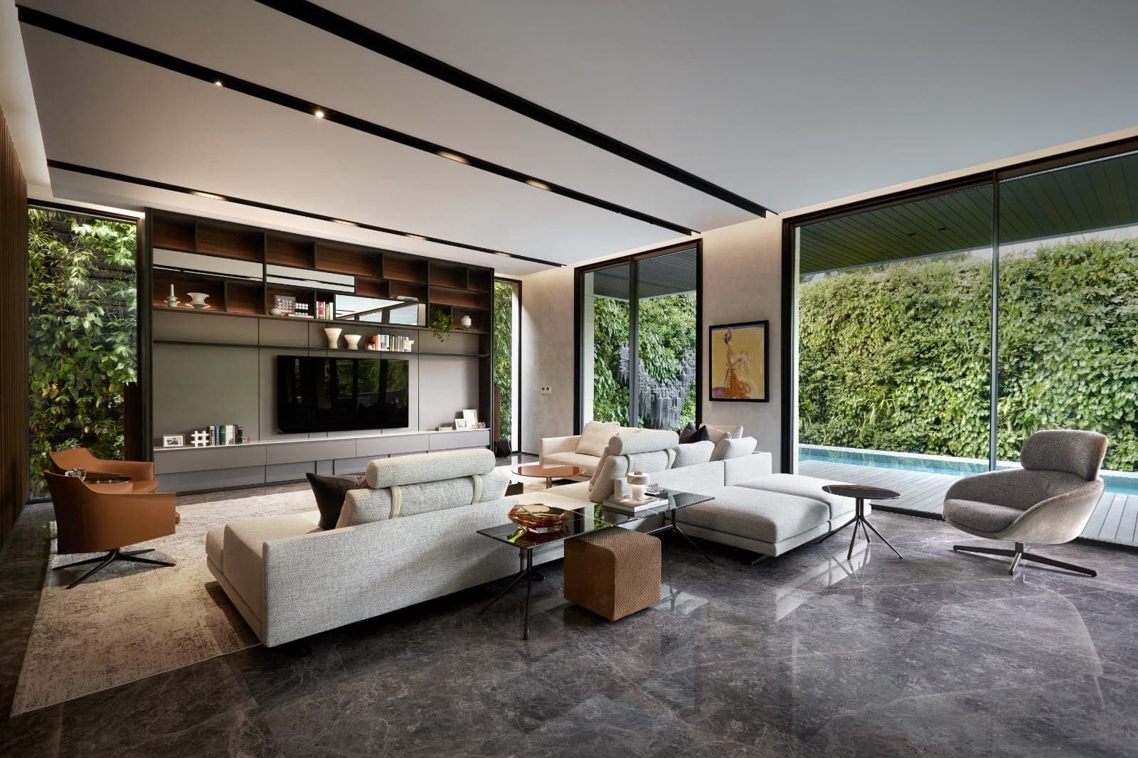 The living room, opened the full width to the pool.