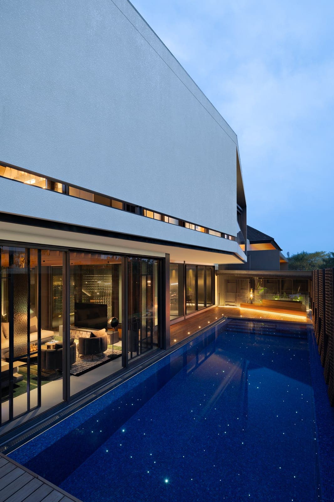 The living room opens the full width; a slot of glazing runs above it.